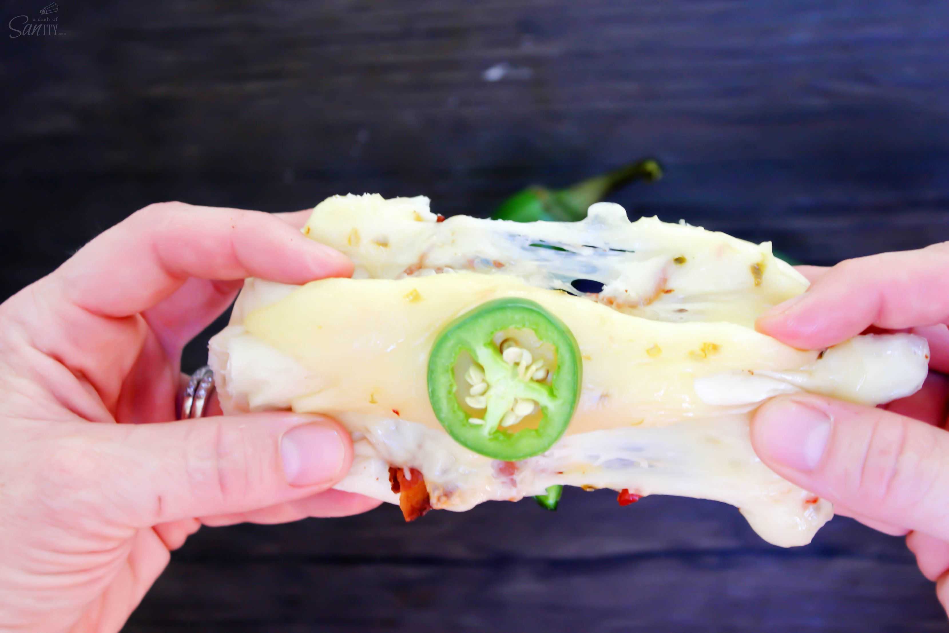 Jalapeño Poppers with cheese, more cheese, bacon, & jalapenos wrapped up in a soft roll, what on earth could be better than that? Oh yeah, more cheese.