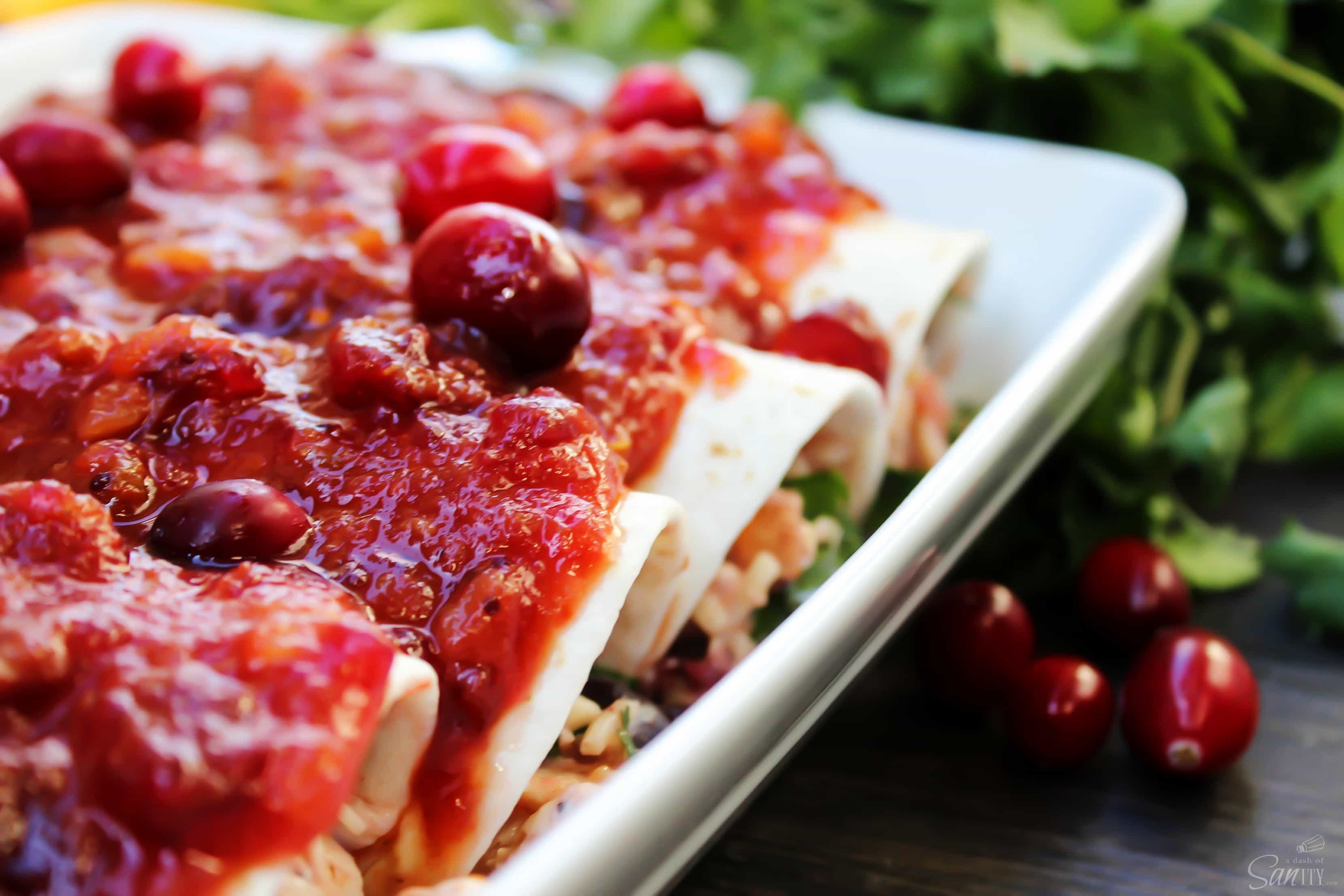 Made with a tangy-sweet sauce these Cran-Turkey Enchiladas are the best twist on enchiladas that I have ever had. Don't wait for the holidays to make these! Made with a tangy-sweet sauce these Cran-Turkey Enchiladas are the best twist on enchiladas that I have ever had. Don't wait for the holidays to make these!
