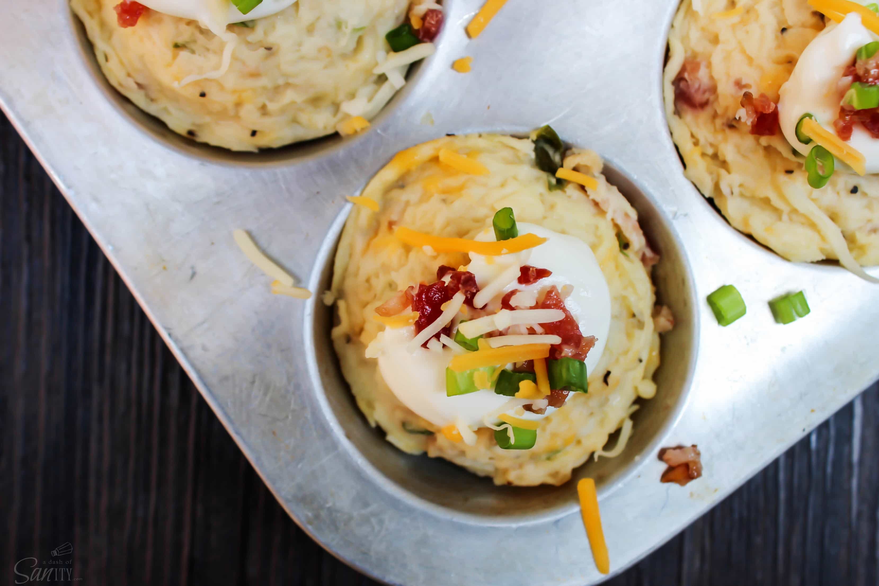These Loaded Mashed Potato Cups are perfect for holiday gatherings. Easy to serve & prepare and are loaded with everything that is good - bacon and cheese.