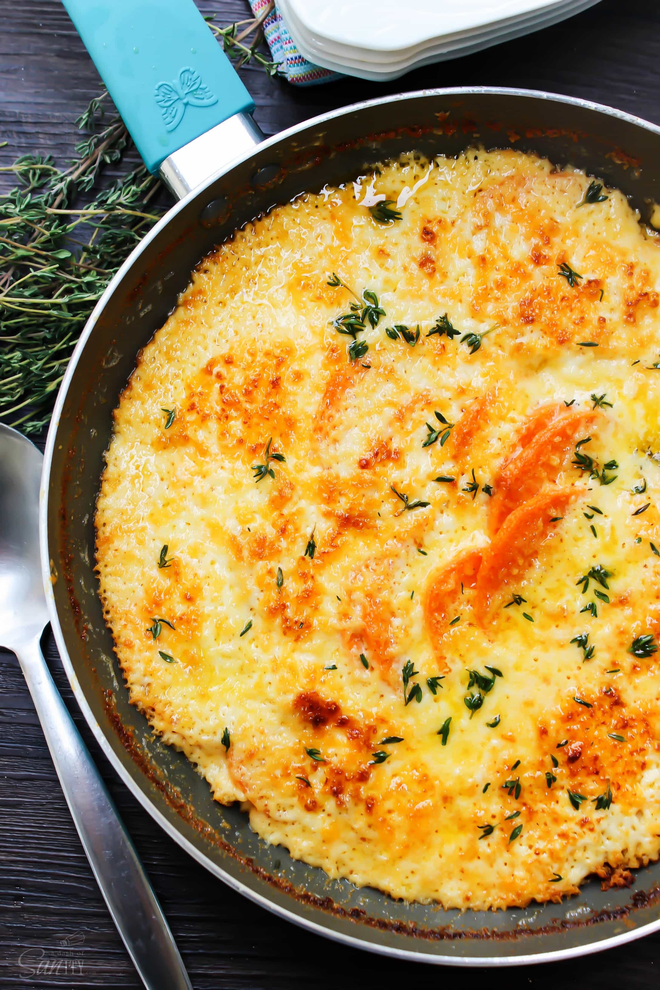 Skillet Scalloped Sweet Potatoes is an elegant twist on a holiday classic of Scalloped Potatoes. Layers of sweet potatoes, cheese, and a white cream sauce. Skillet Scalloped Sweet Potatoes is an elegant twist on a holiday classic of Scalloped Potatoes. Layers of sweet potatoes, cheese, and a white cream sauce.