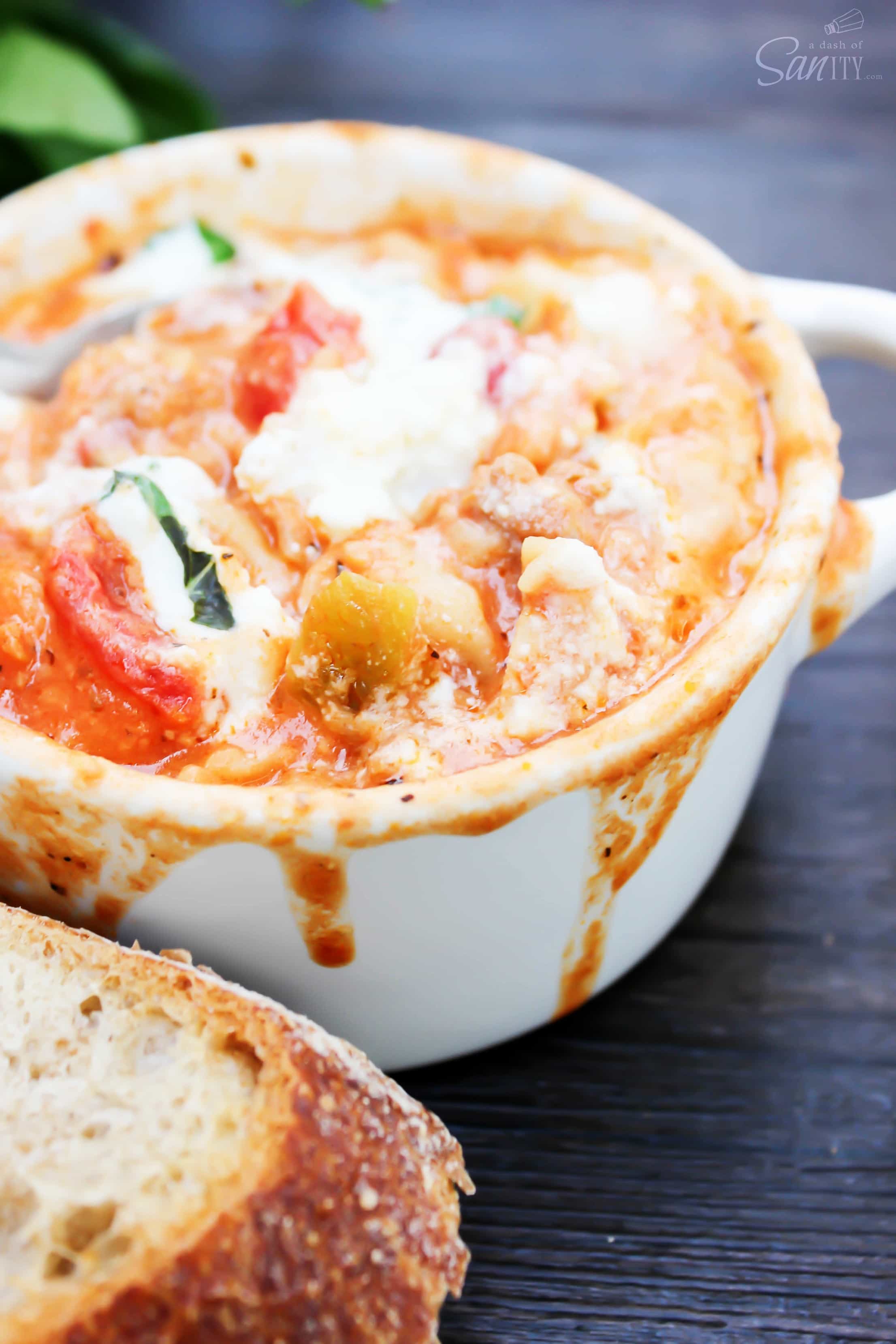 This Slow Cooker Lasagna Soup is comfort food at its best. Let it simmer all day while it fills up the house with the aroma of tomatoes and basil.