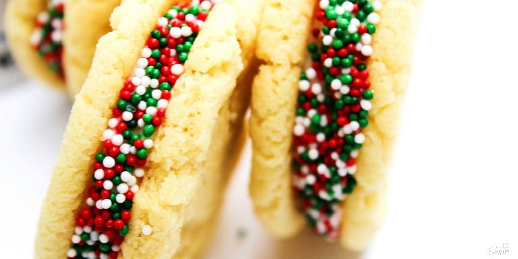 Mini Sugar Cookie Sandwiches are made from whipped buttercream frosting smashed in between two-bite sized chewy sugar cookies, all with a secret ingredient.