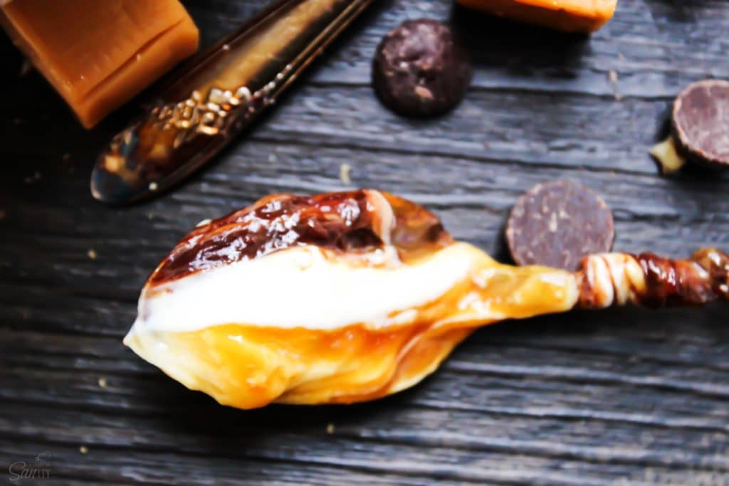 No-Bake Turtle Cheesecake Dip on spoon 