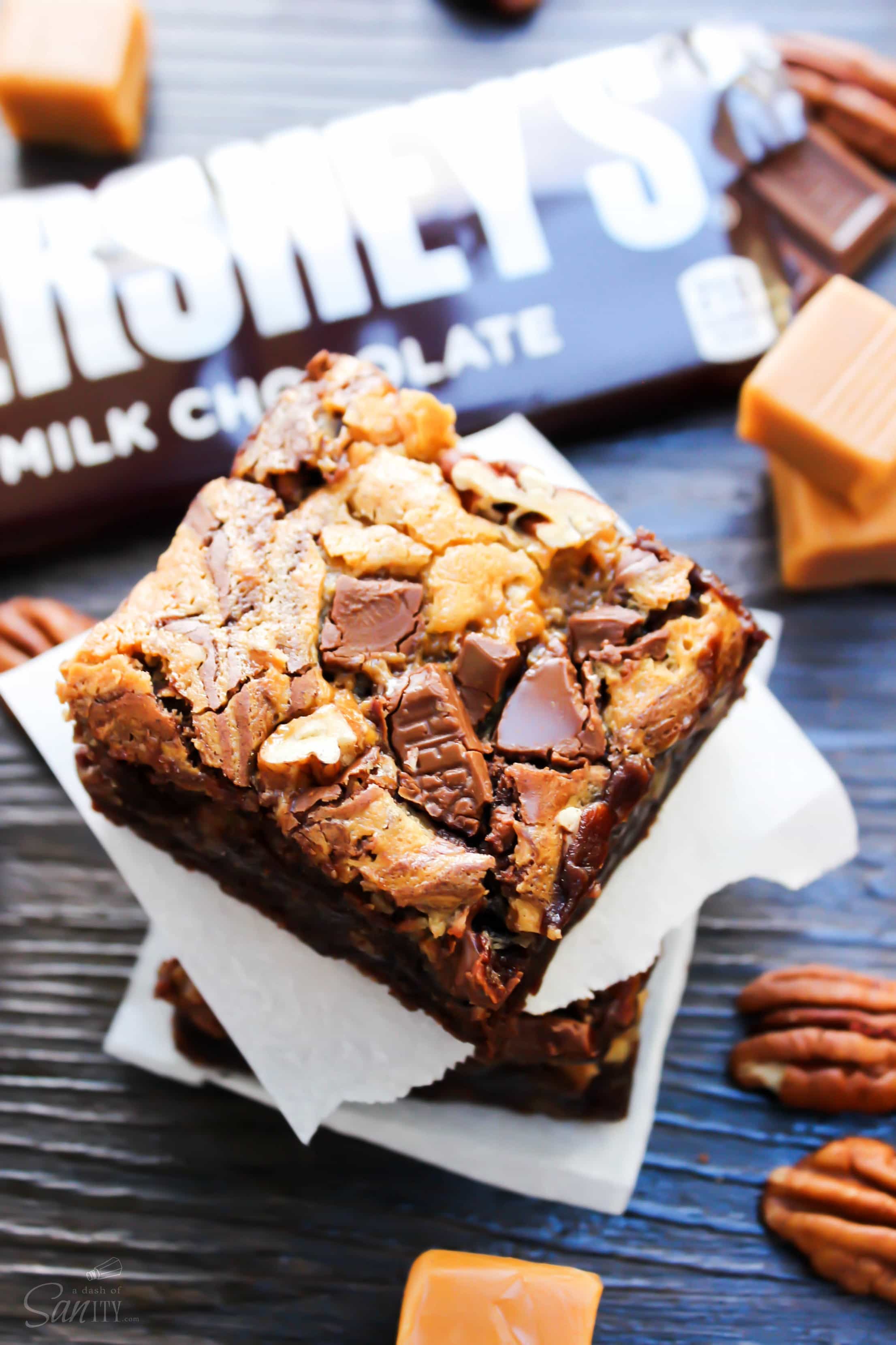Turtle Cheesecake Fudge Brownies are rich fudge brownies with a caramel cheesecake swirl, topped with chopped pecans. #Spreadcheer with this decadent treat. Turtle Cheesecake Fudge Brownies are rich fudge brownies with a caramel cheesecake swirl, topped with chopped pecans. #Spreadcheer with this decadent treat.