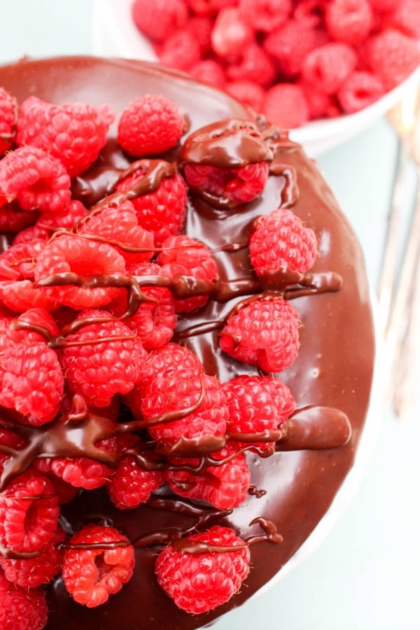 overhead shot chocolate cake with fresh raspberries