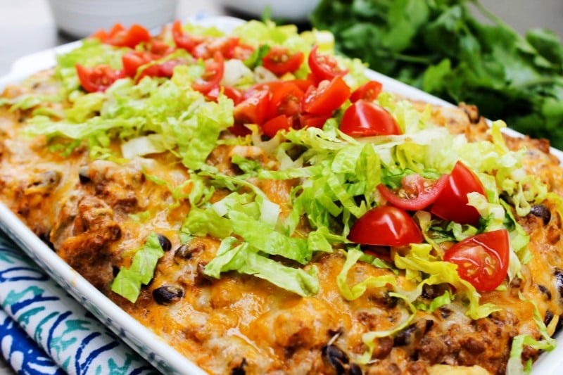Easy Beef Enchilada Bake is a delicious, easy to make twist on classic enchiladas. This 30-minute meal will be one that the whole family loves.