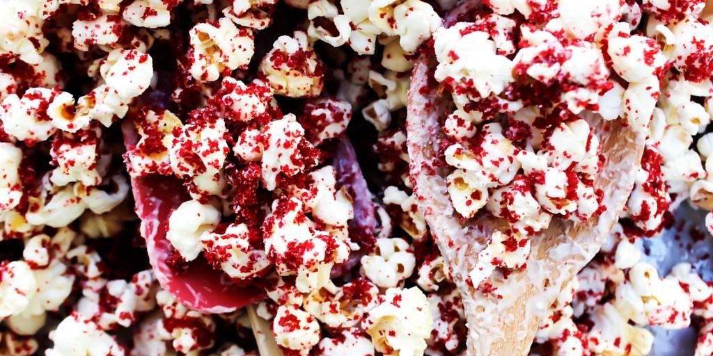 red velvet cake over popcorn and spoons
