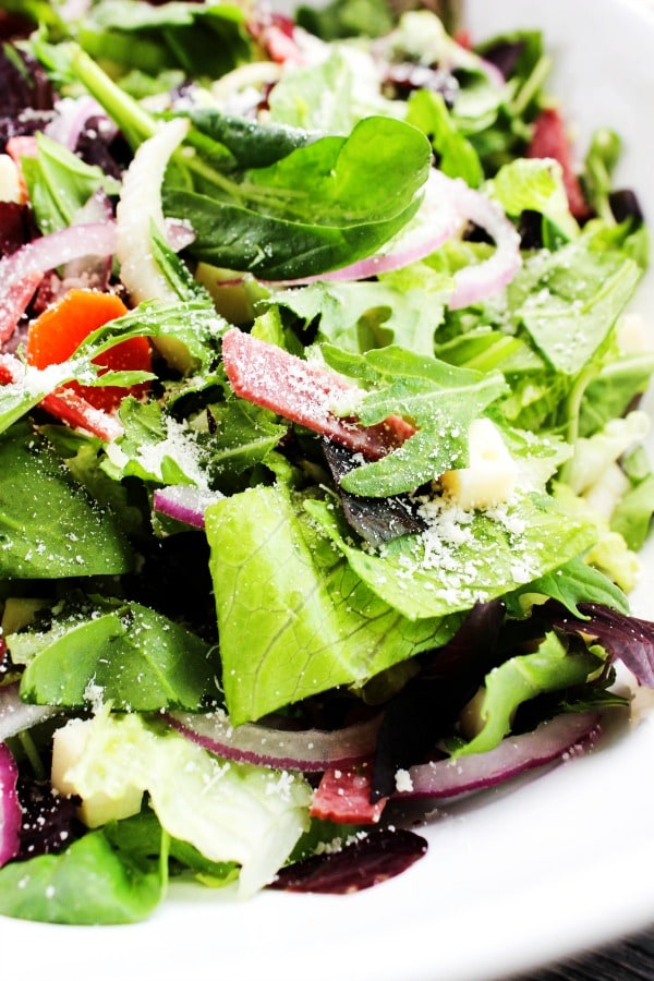 Copycat Carrabba's Chopped Salad is filled with flavors, textures, and a pop of color from the salami and kalamata olives. This salad is perfect for summer.