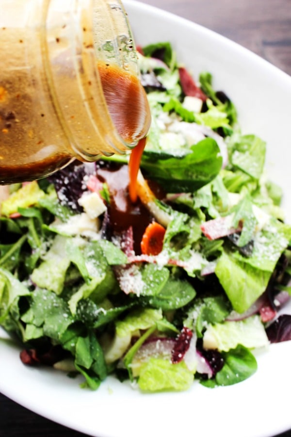 Copycat Carrabba's Chopped Salad is filled with flavors, textures, and a pop of color from the salami and kalamata olives. This salad is perfect for summer.