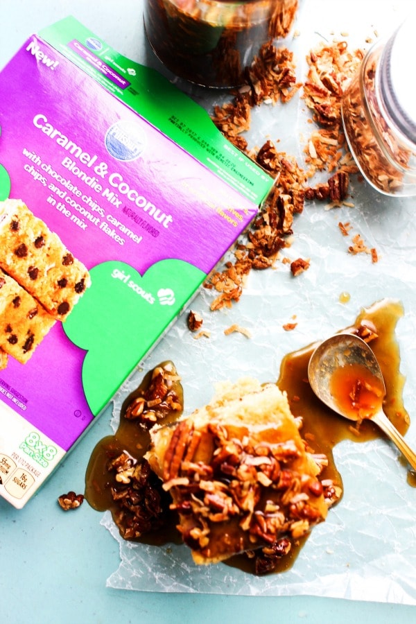Toasted Coconut Pecan Caramel Sauce & Girl Scouts® Caramel & Coconut Blondies are a drool worthy combination of coconut, caramel, and chocolate.