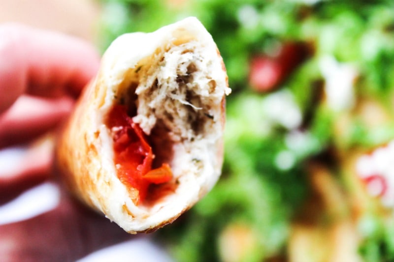 Slow Cooker Greek Chicken Taquitos is a twist on classic chicken taquitos. Made with fresh tomatoes, feta, and Greek dressing, this is so easy & delicious. 