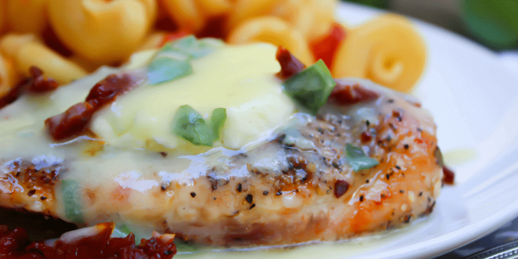 Chicken Bryan on a white plate with lemon butter sauce