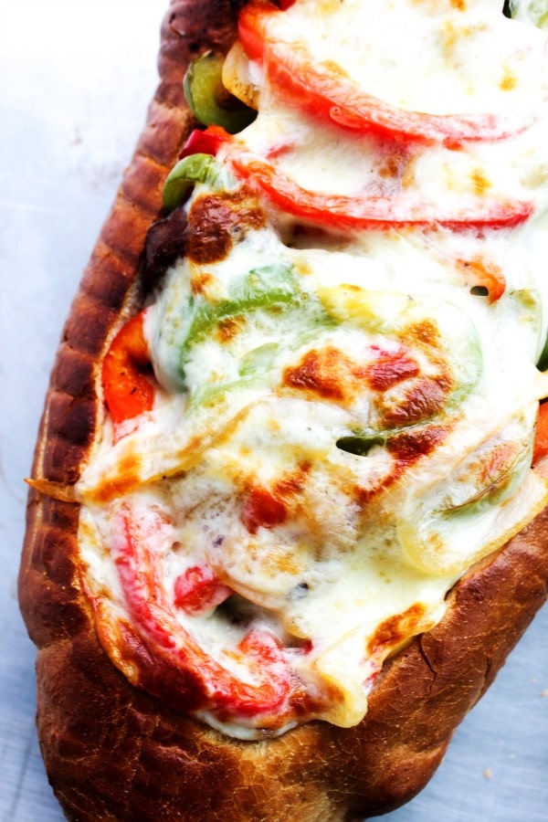 Cheesy Italian Sausage & Pepper Stuffed Bread is a twist the classic ball park sandwich, made into a fantastically easy meal. Cheesy Italian Sausage & Pepper Stuffed Bread is a twist the classic ball park sandwich, made into a fantastically easy meal. sausage-pepper-stuffed-bread-view