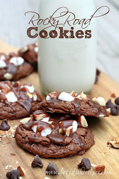 Rocky Road Chocolate cookies topped with almonds, marshmallows, and drizzled with more chocolate. 