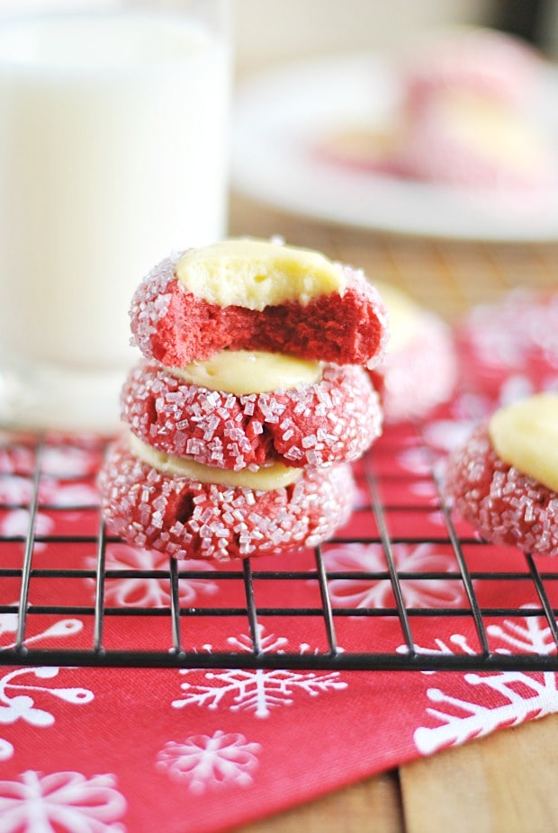 Red Velvet Cream Cheese Thumbprint Cookies rolled in white sugar sprinkles