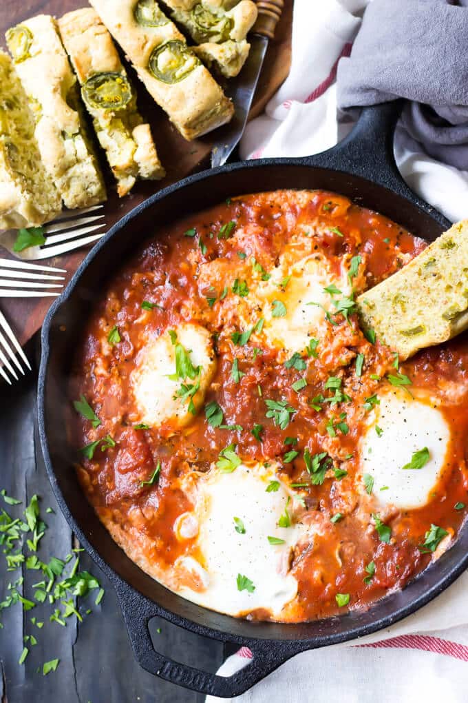 overhead photo of eggs in tomato sauce.