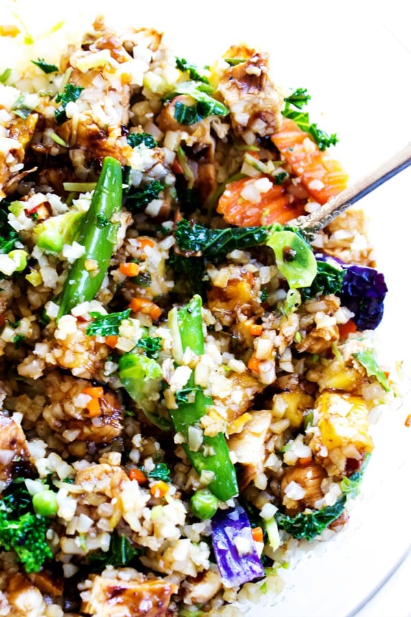 These Sweet Ginger Teriyaki Chicken Bowls made in just 30 minutes, are a healthy, filling, yet delicious dinner that will have you skipping take-out. photo of Sweet Ginger Teriyaki Chicken Bowl veggies in a glass mixing bowl