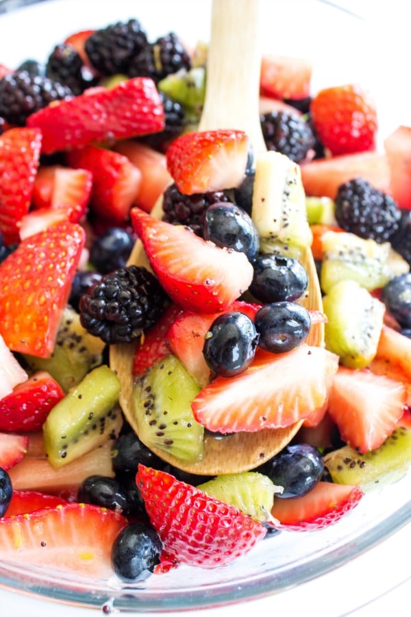 bowl of fruit salad with serving spoon