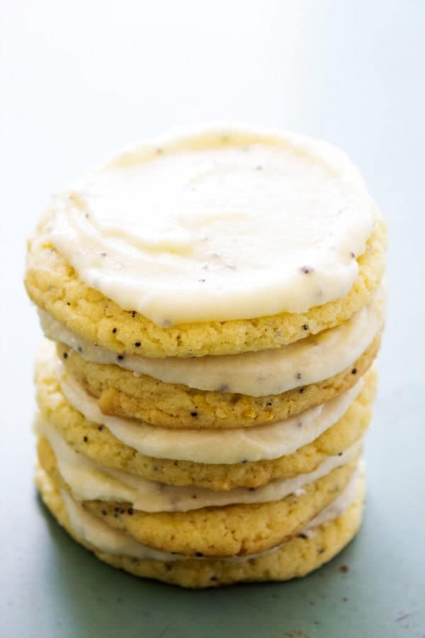 stack of 5 Lemon Poppy Seed Sugar Cookies with lemon buttercream frosting