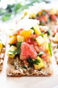 close up shot of mango margherita sauce on cracker