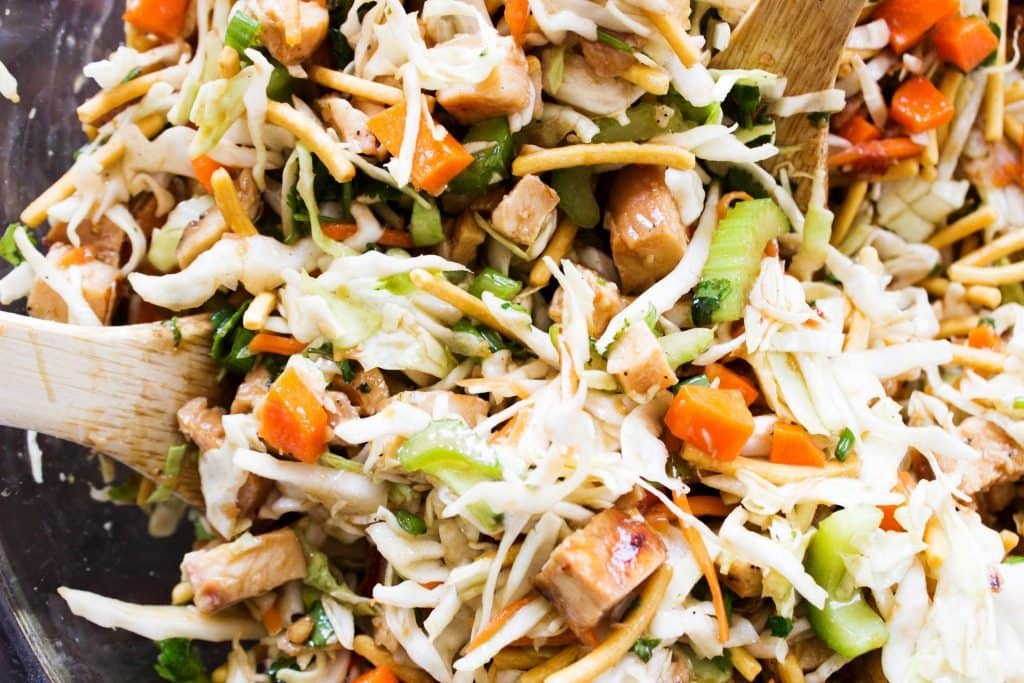 overhead shot of the salad being tossed together