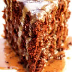 single slice of chocolate cake with caramel drizzle and ganache