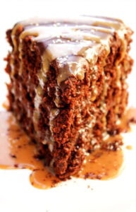 single slice of chocolate cake with caramel drizzle and ganache