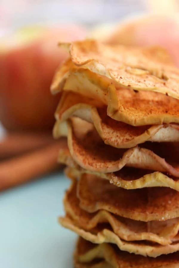 BAKED CINNAMON SUGAR APPLE SLICES are a perfect snack. Crispy baked apples slices coated in cinnamon and sugar like a fruit chew but better! BAKED CINNAMON SUGAR APPLE SLICES are a perfect snack. Honey crisp apples and cinnamon.