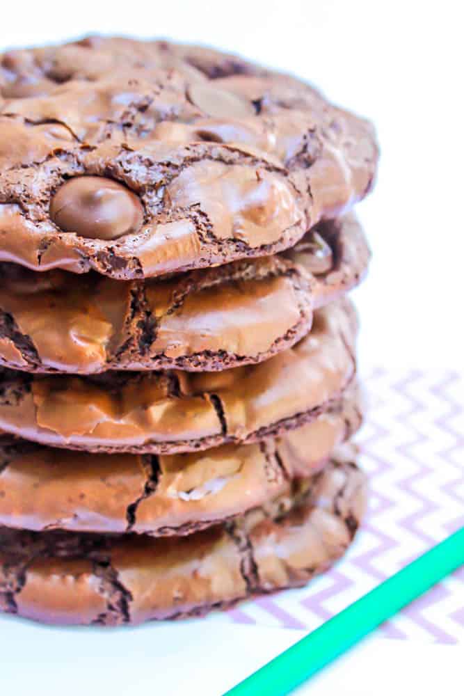a stack of chewy flourless chocolate cookies