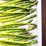 overhead shot of roasted asparagus on a sheet pan.