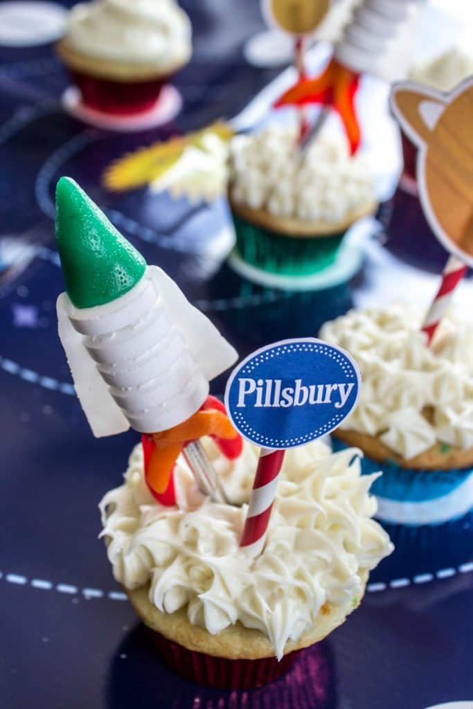 EASY ROCKET CUPCAKES Cupcake on galaxy themed table 