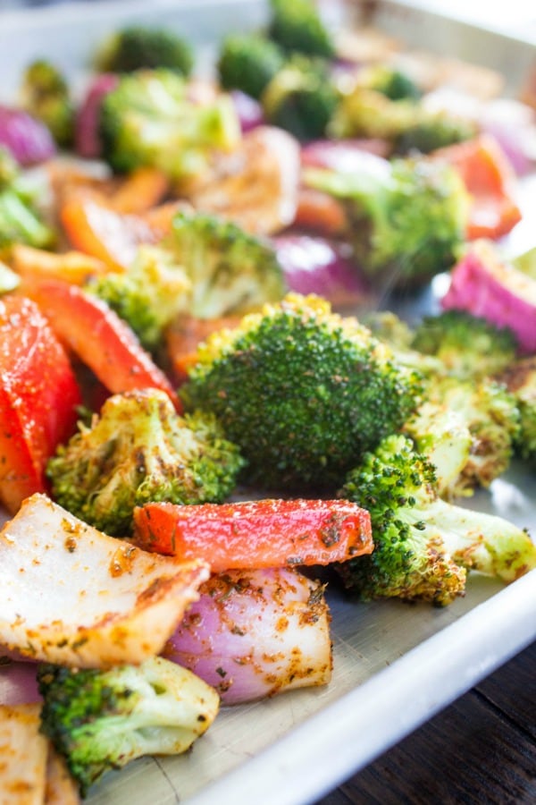 SHEET PAN CAJUN SHRIMP - Broccoli, peppers and onions on sheet pan 