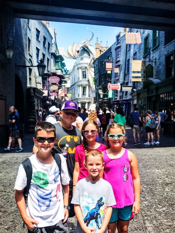 photo of sandra's 5 kids standing in hogwarts park in universal studios