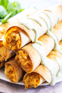 stack of taco taquitos with chicken and dressing