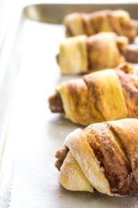 BREAKFAST PIGS IN A BLANKET - a cinnamon roll wrapped around a breakfast sausage link. There isn't a more delicious way to eat "pigs in a blanket".