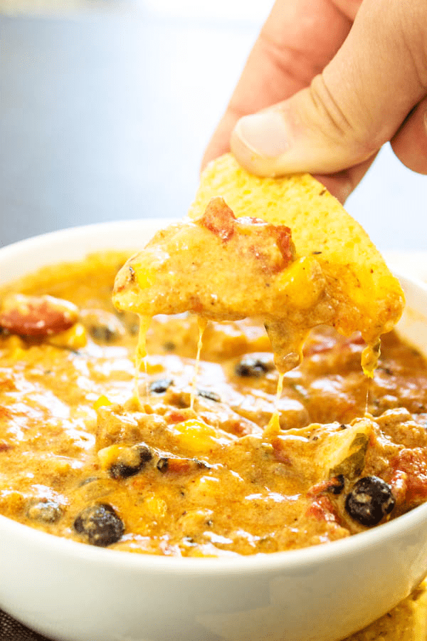 SLOW COOKER CHILI CHEESE DIP – cheesy and full of flavor, this easy recipe will score a win on game day and be a hit during the holidays.