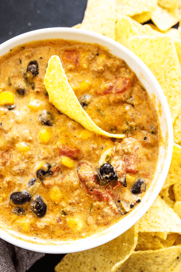 SLOW COOKER CHILI CHEESE DIP – cheesy and full of flavor, this easy recipe will score a win on game day and be a hit during the holidays.