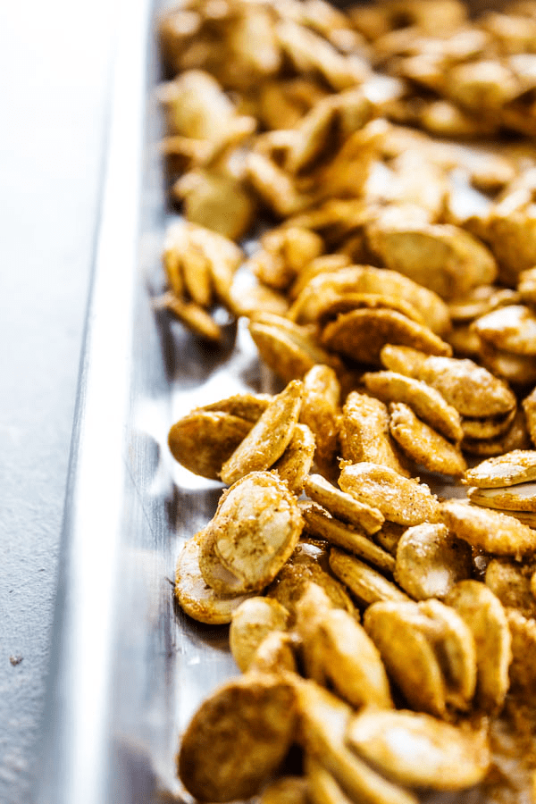 photo of CINNAMON SUGAR PUMPKIN SEEDS on a sheet pan