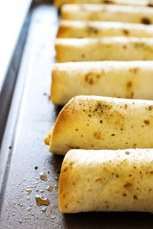 Chicken Parmesan Taquitos - Filled with chicken, cheeses & Italian seasoning, dunk in a marinara sauce & you have a simpler twist on an Italian classic.