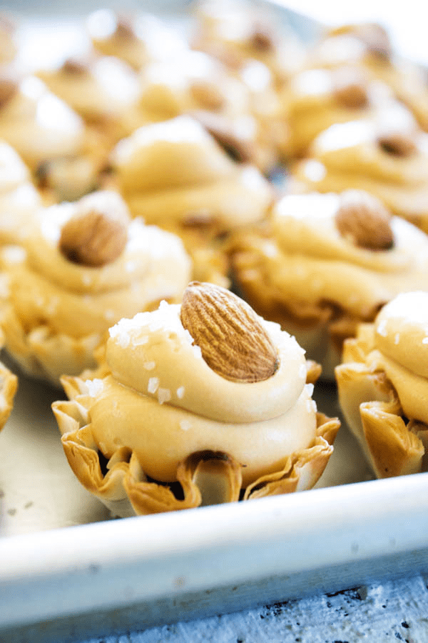 NO-BAKE SALTED CARAMEL CHEESECAKE TARTS - These mouthwatering tarts are ready in 30 minutes, making them an easy dessert to serve over the holidays.