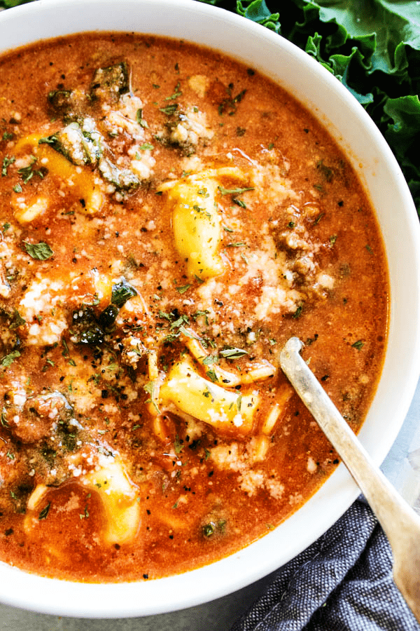 This hearty SLOW COOKER TUSCAN TORTELLINI SOUP will be a family favorite. Delicious & easy to make, you're simply going to love how easy it comes together. SLOW COOKER TUSCAN TORTELLINI SOUP above with spoon