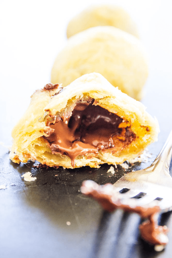 Pain Au Chocolat cut in half with a fork