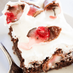 CHOCOLATE COVERED CHERRY POKE CAKE - A rich & gooey chocolate cake with chocolate covered cherries; spread some holiday cheer with this simple dessert.