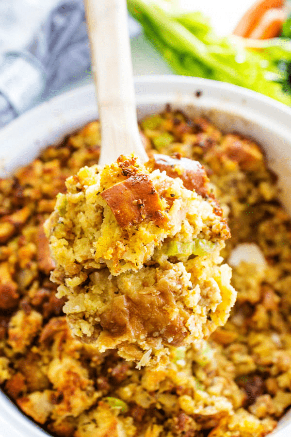 overhead shot cornbread stuffing with serving spoon