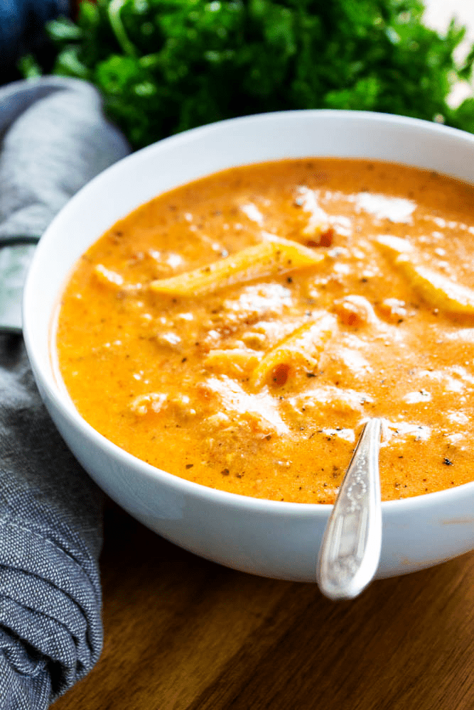 bowl of soup in white bowl with spoon
