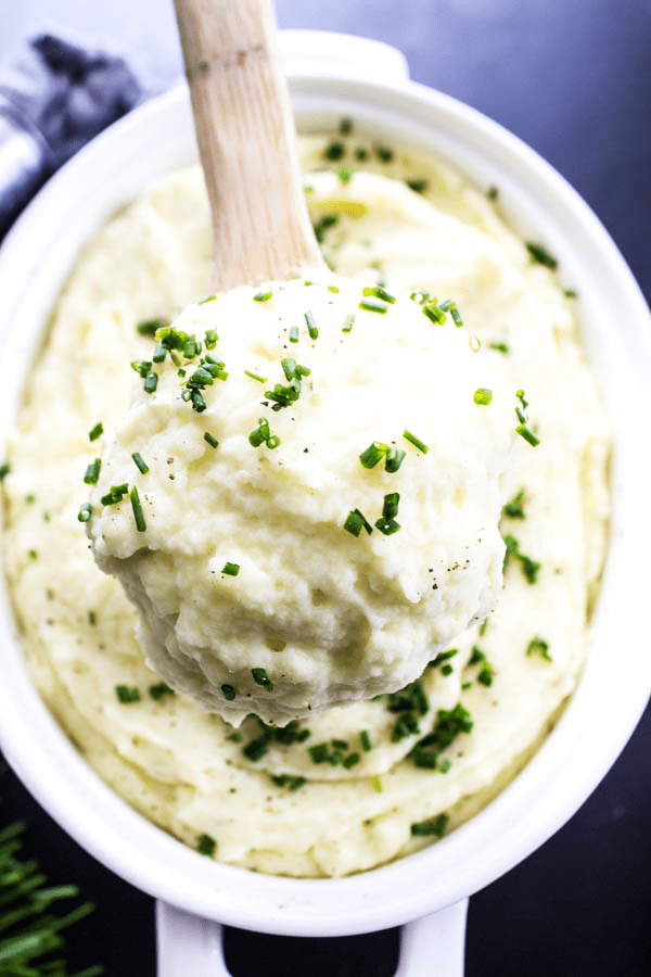 wooden spoon with a scope of mashed potatoes