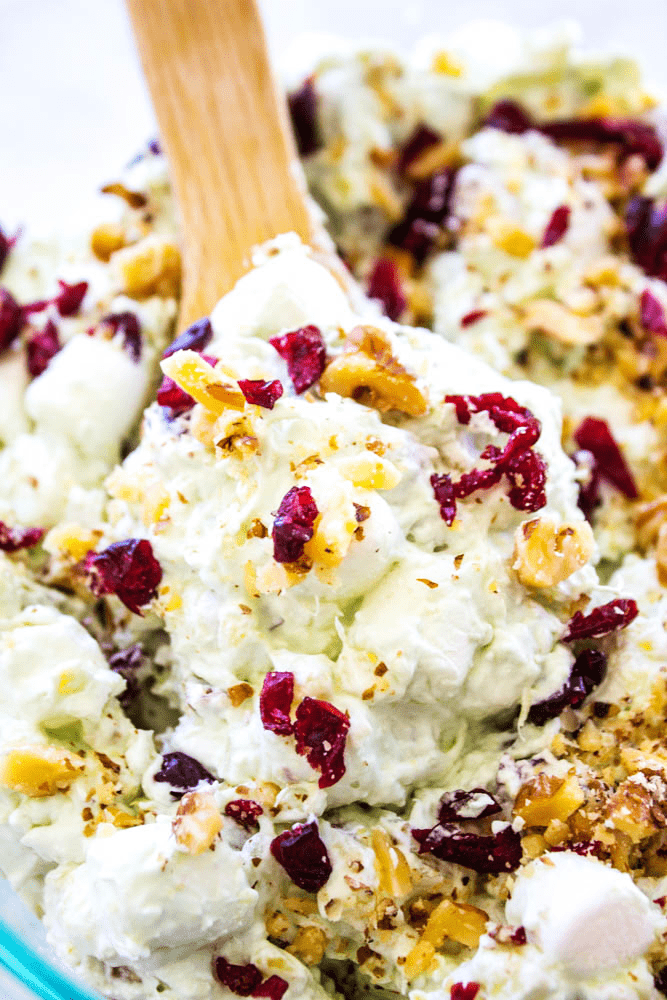 WATERGATE SALAD - A classic & traditional holiday side dish that everyone loves. Made with Cool Whip, marshmallows, pistachio pudding and pineapple, it's deliciously easy.