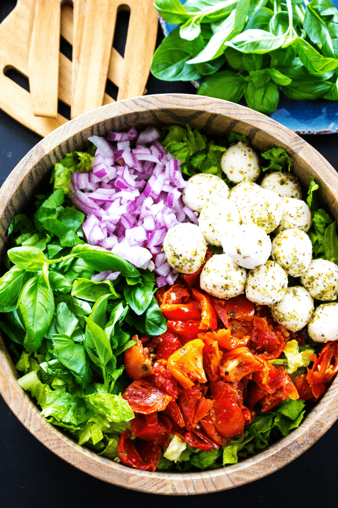 Amazingly simple & insanely delicious this CHOPPED CAPRESE SALAD is a great salad to feed a crowd over the holiday season.