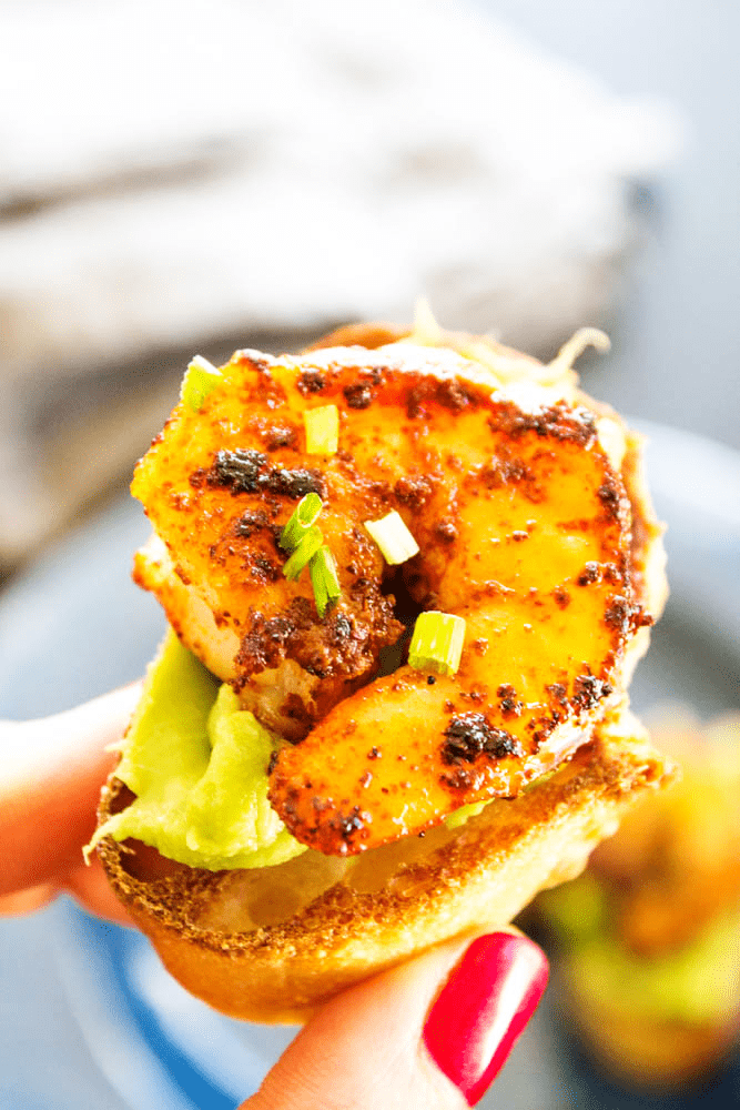 Simple, easy and insanely delicious, this recipe for CHILI RUBBED SHRIMP AND AVOCADO CROSTINI makes a great appetizer, snack or meal for busy nights. up close Chili Rubbed Shrimp and Avocado Crostini