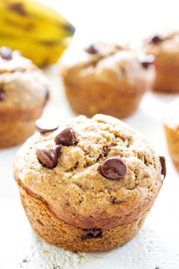 Banana Chocolate Chip Muffins laid out on a table